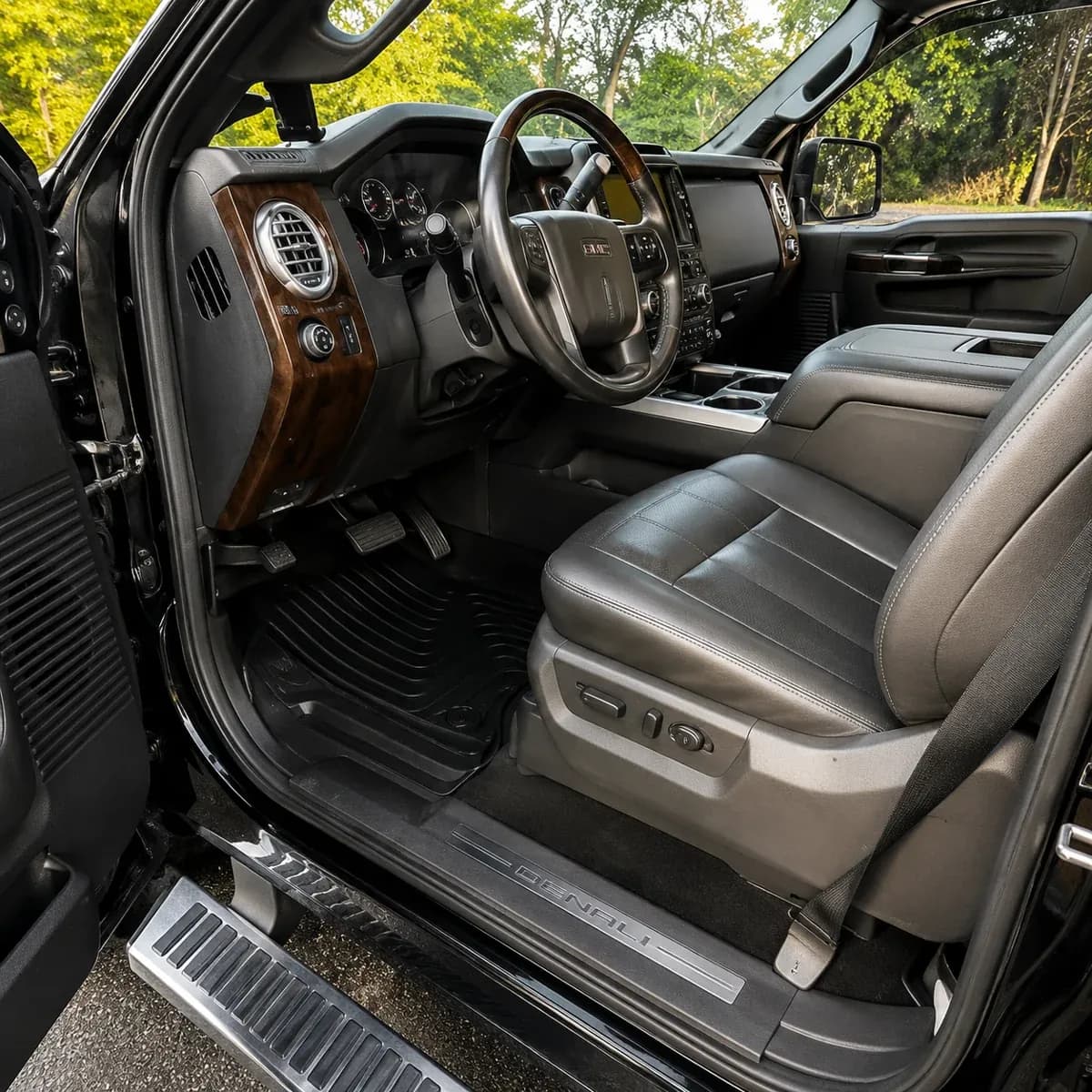 GMC Denali interior after a full detail, spotless mats and conditioned leather